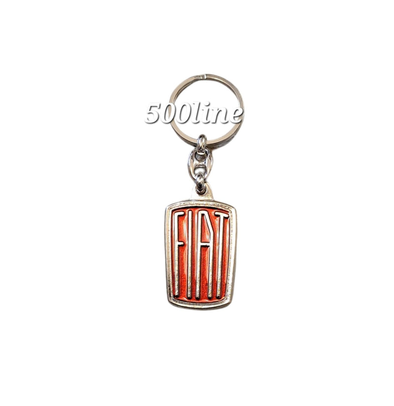 Metalen sleutelhanger met rode achtergrond en Fiat-logo